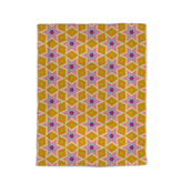 Cozy comforter with polka dot design on a plush bed.